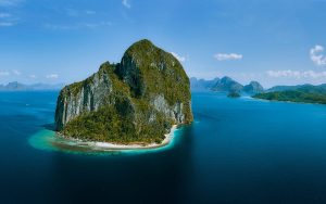 Limestone karst cliffs rising from the sea in Bacuit Bay, El Nido